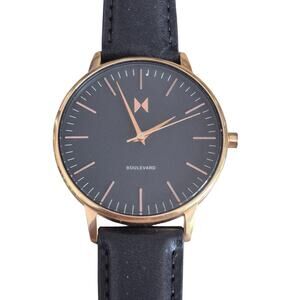 MVMT Mens Watch Black dial with gold trim matching band Corp core Great shape